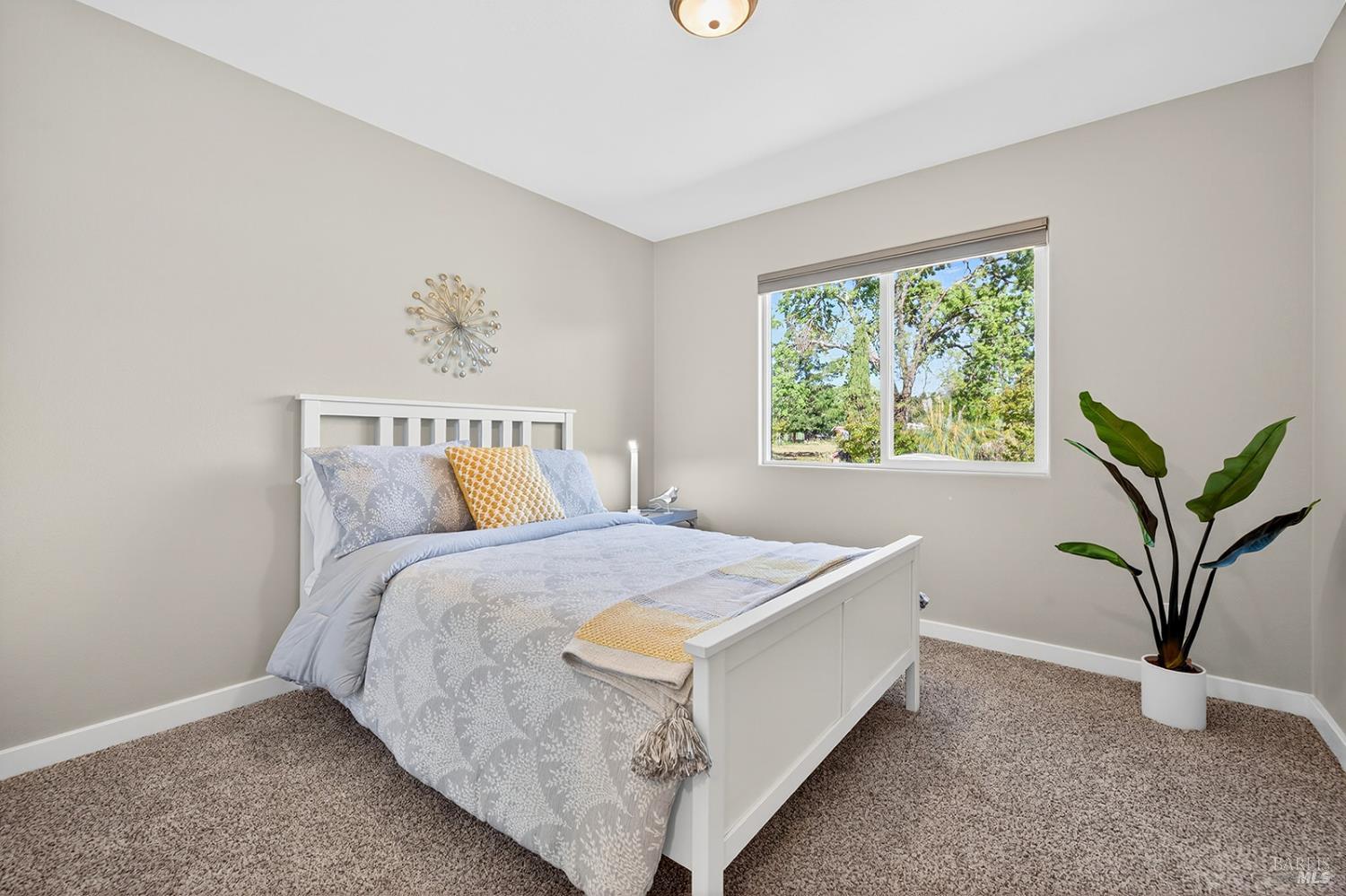 4720 Granada Drive Santa Rosa, CA 95409 - Photo 44 of 68 a bedroom with a bed and window