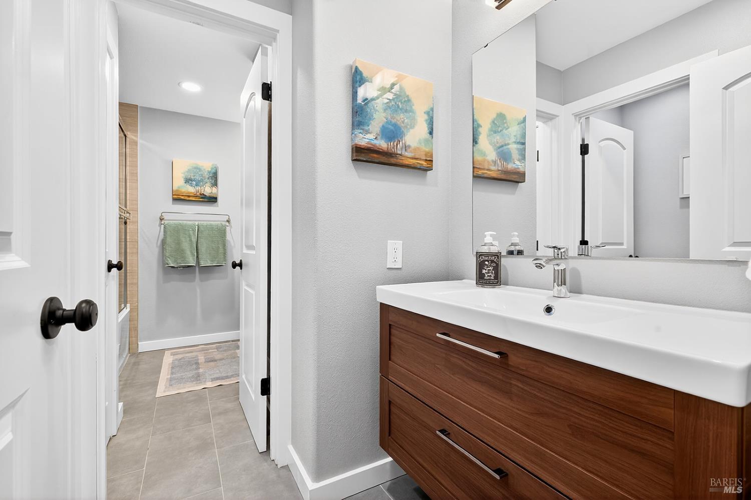 4720 Granada Drive Santa Rosa, CA 95409 - Photo 46 of 68 a bathroom with a sink and mirror