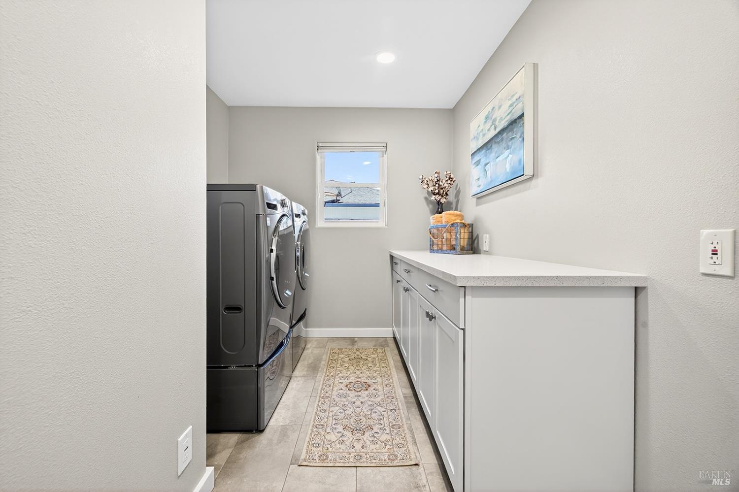 4720 Granada Drive Santa Rosa, CA 95409 - Photo 54 of 68 a utility room with cabinets washer and dryer