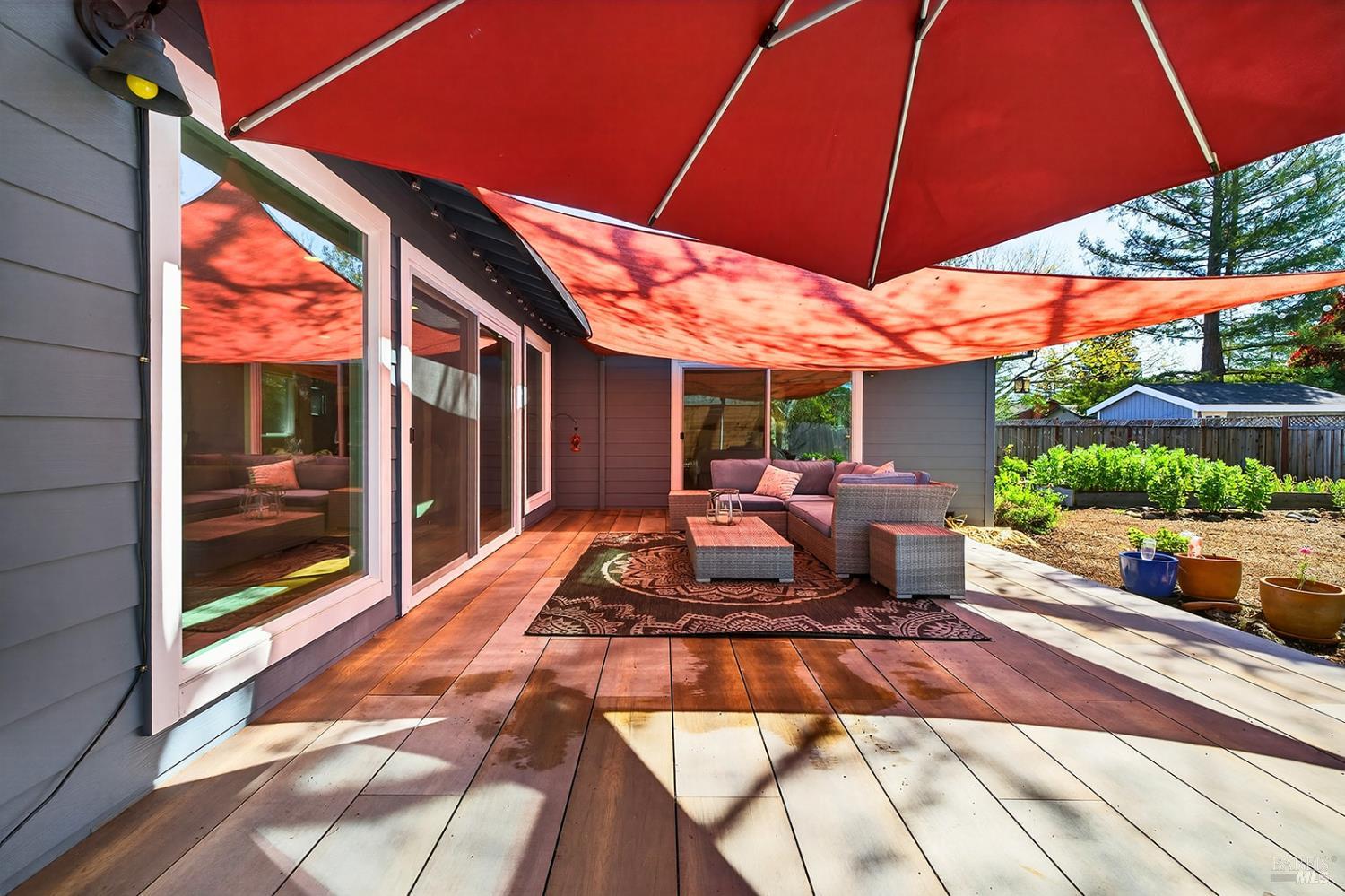 4720 Granada Drive Santa Rosa, CA 95409 - Photo 56 of 68 a view of a patio with table and chairs under an umbrella