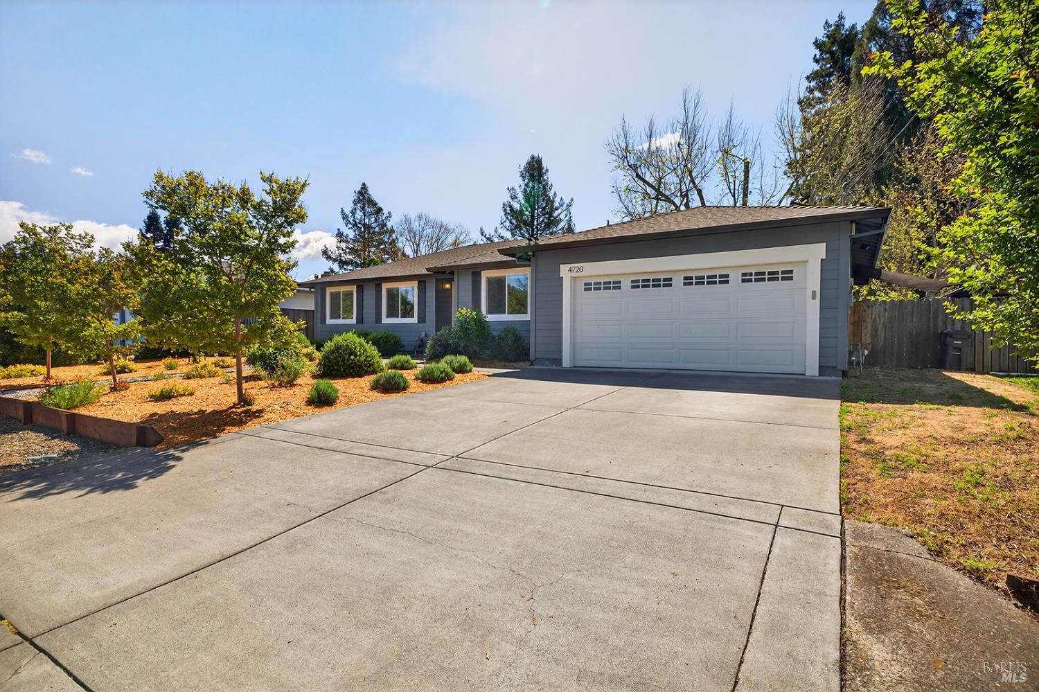 4720 Granada Drive Santa Rosa, CA 95409 - Photo 62 of 68 a front view of a house with a yard and garage