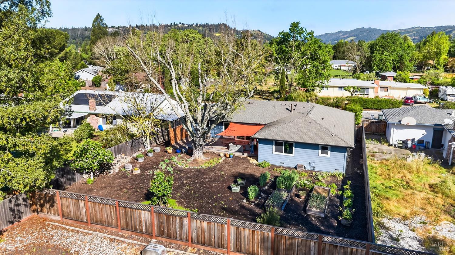 4720 Granada Drive Santa Rosa, CA 95409 - Photo 68 of 68 a view of a house with a flower garden in front of it