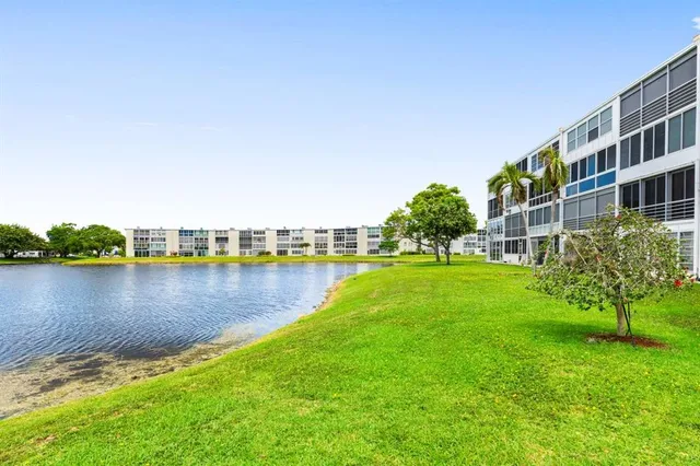 a view of a brick house with a large window