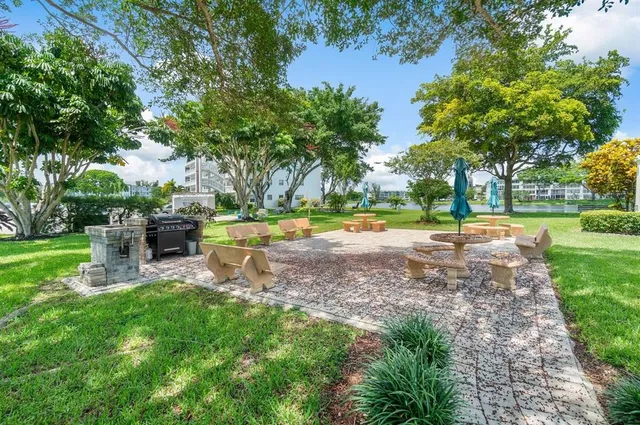 a view of a big yard with a swimming pool