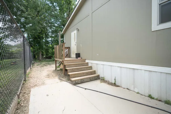 a view of entryway with wooden floor and a yard