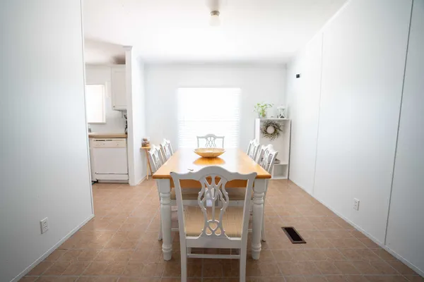an dining room with furniture and window