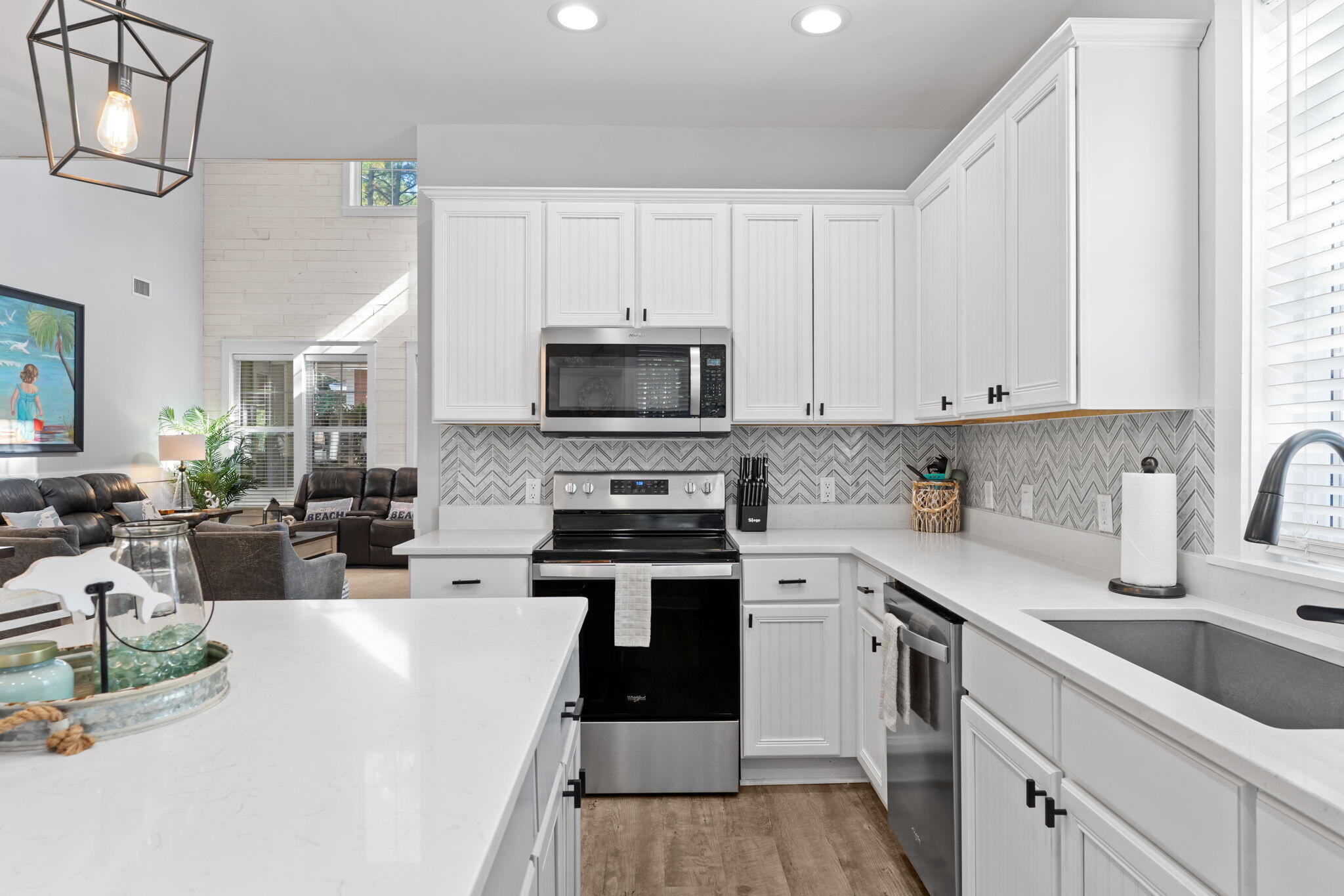1352 Ravens Run West Miramar Beach, FL 32550 - Photo 17 of 50 a kitchen with a sink a stove and cabinets