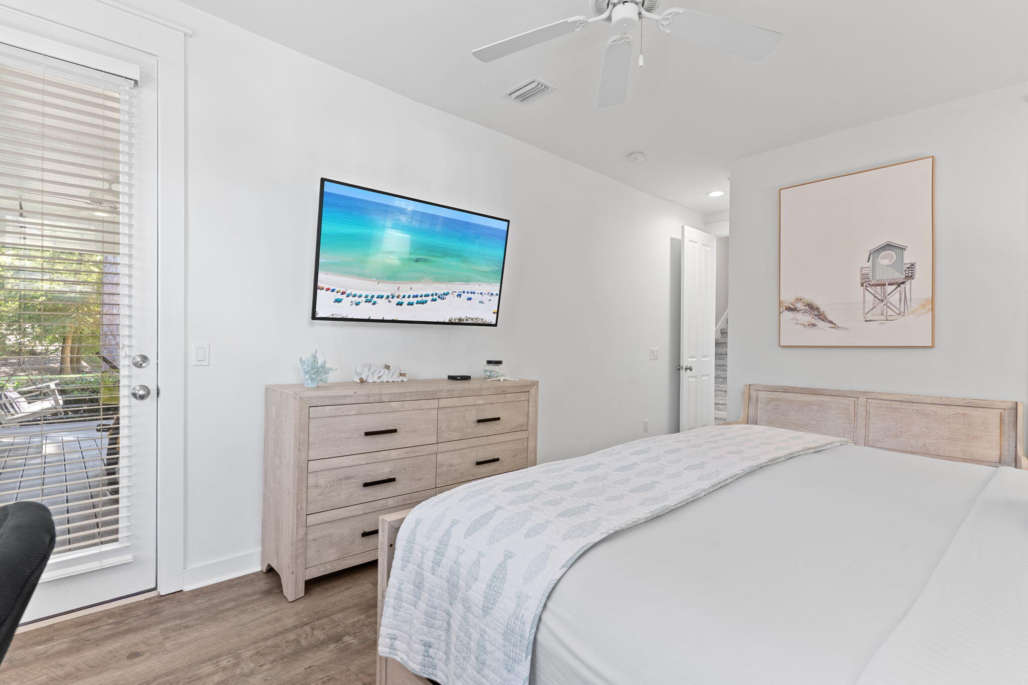 1352 Ravens Run West Miramar Beach, FL 32550 - Photo 23 of 50 a bedroom with a bed and a flat screen tv