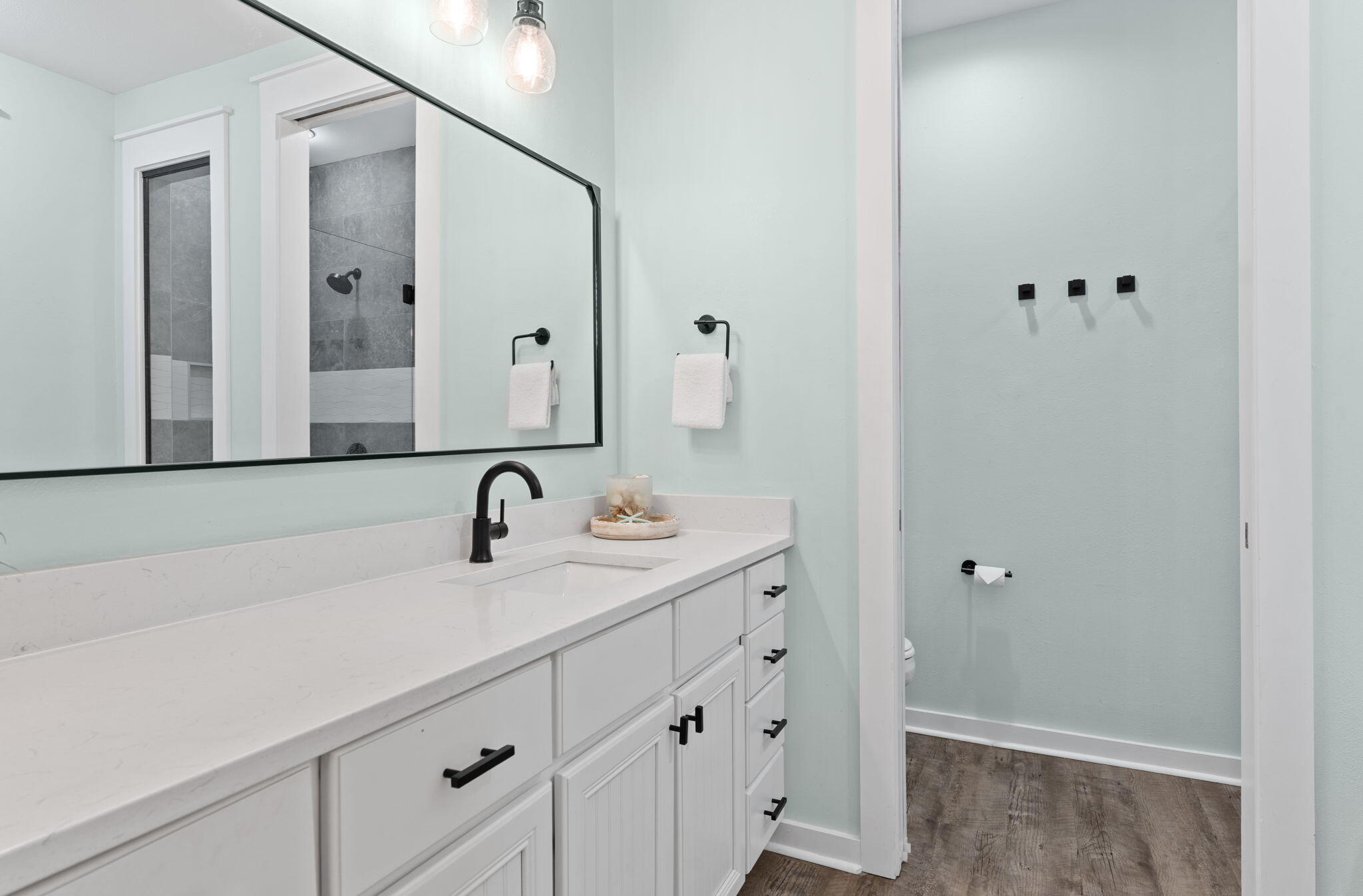 1352 Ravens Run West Miramar Beach, FL 32550 - Photo 24 of 50 a bathroom with a sink and a mirror