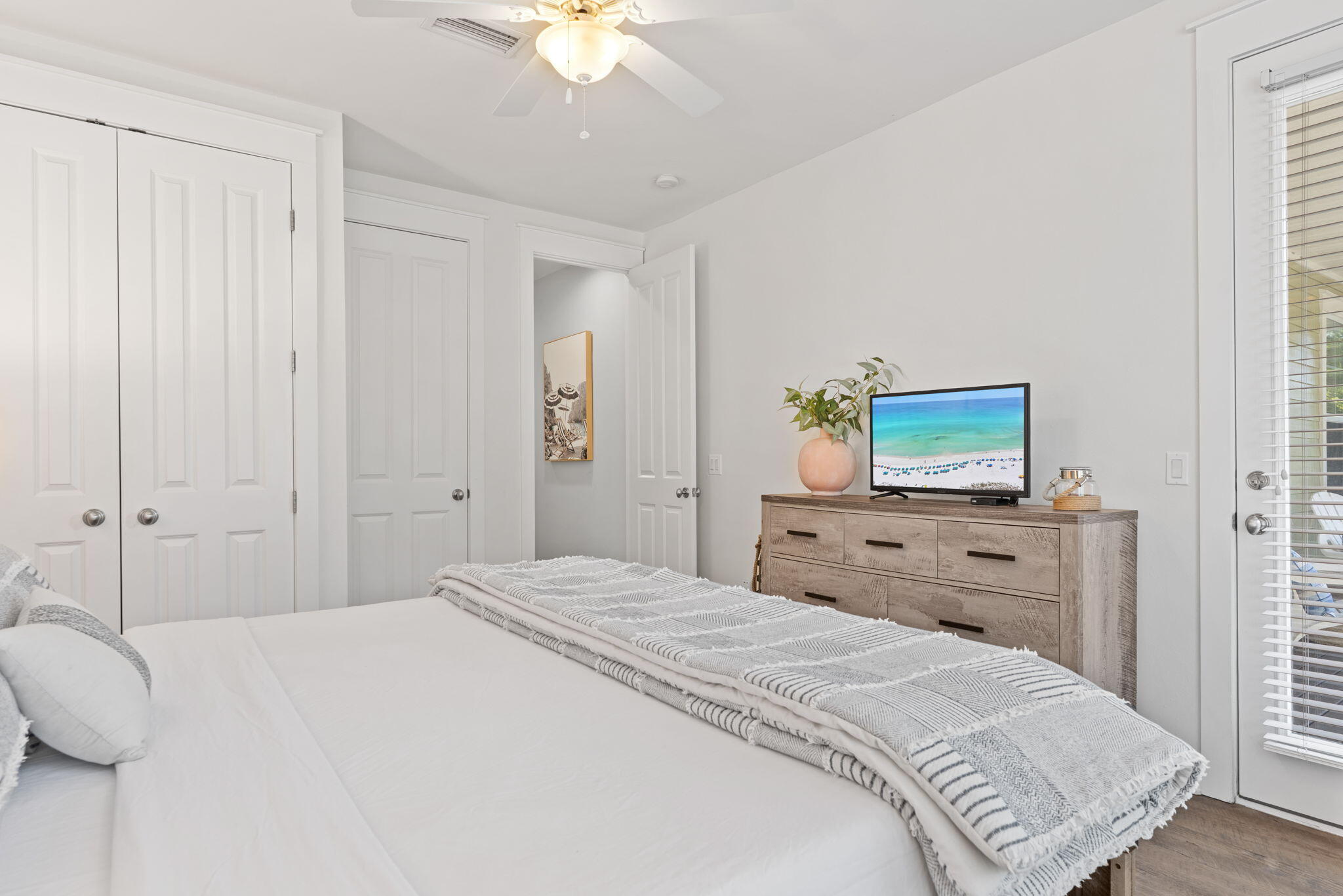 1352 Ravens Run West Miramar Beach, FL 32550 - Photo 29 of 50 a bedroom with a bed and a chandelier
