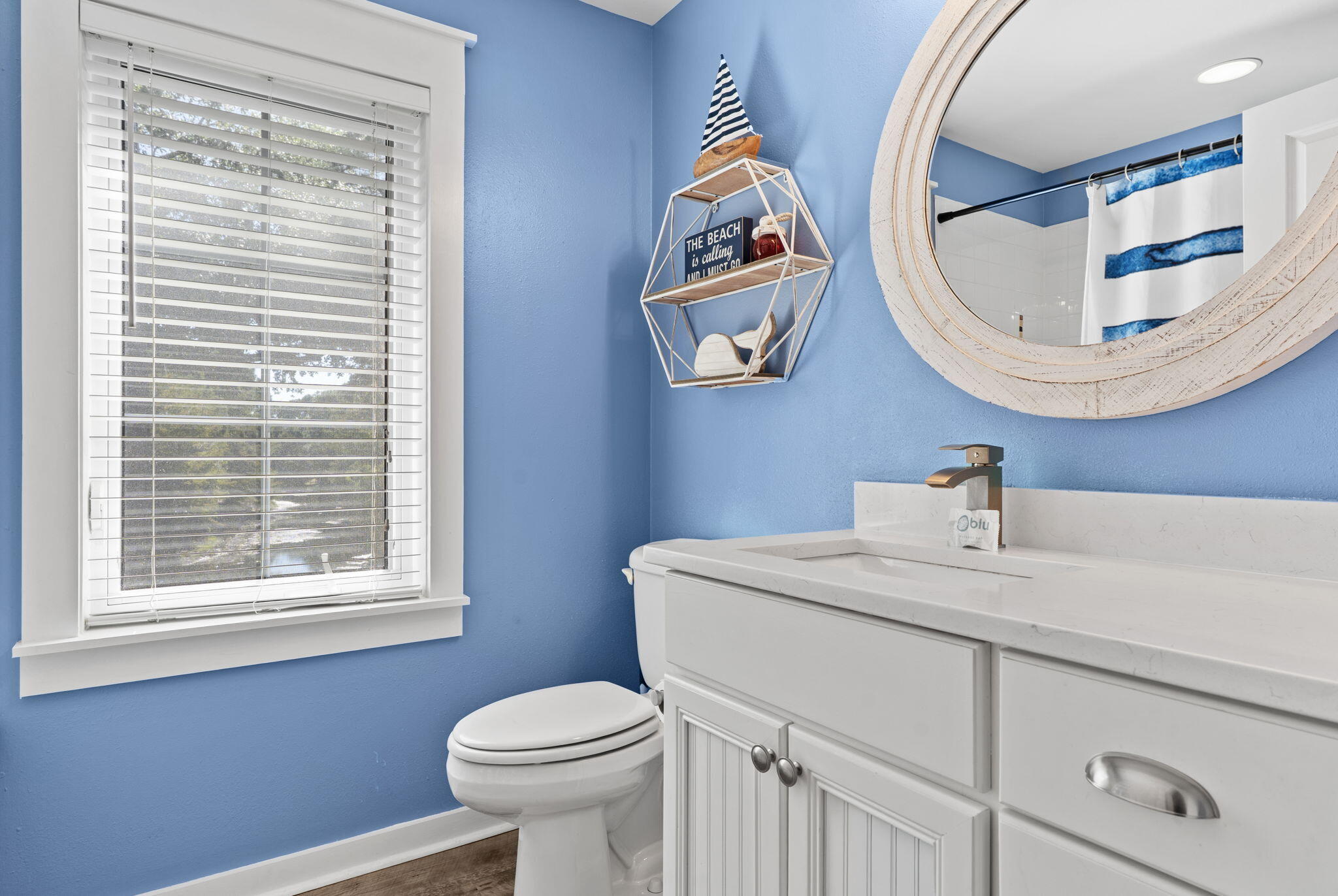 1352 Ravens Run West Miramar Beach, FL 32550 - Photo 37 of 50 a bathroom with a sink a mirror and a toilet