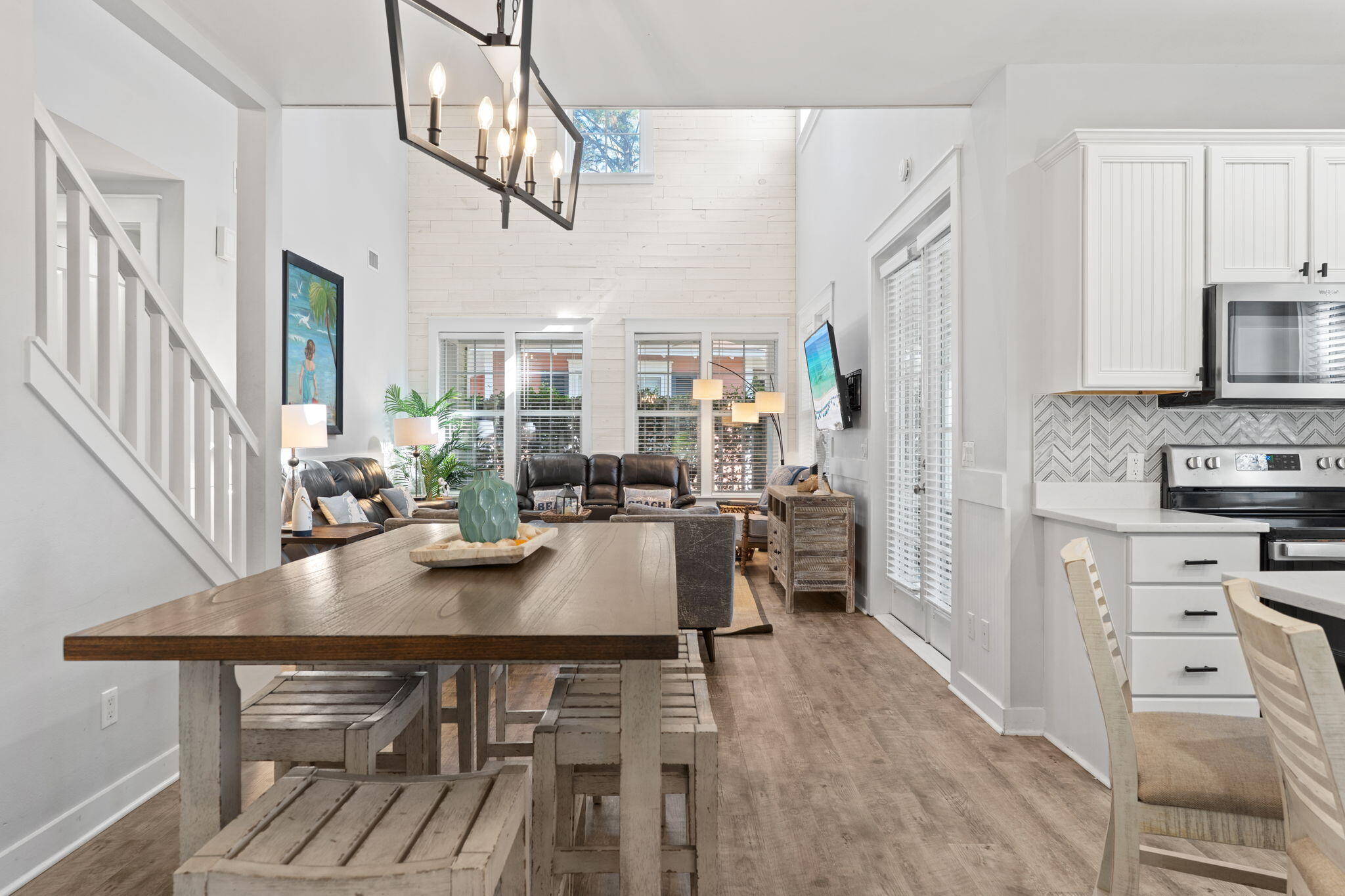 1352 Ravens Run West Miramar Beach, FL 32550 - Photo 5 of 50 a view of a dining room with furniture a kitchen and chandelier