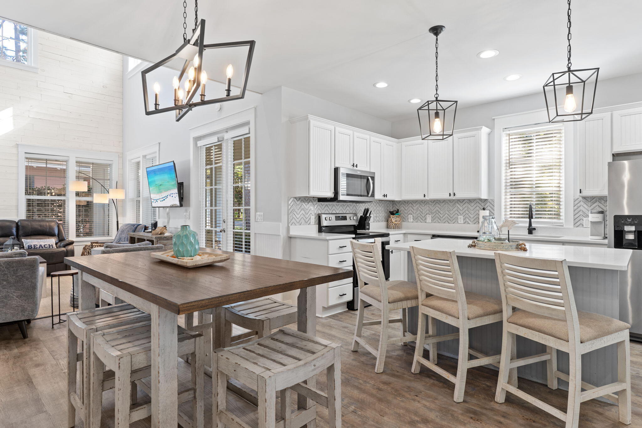 1352 Ravens Run West Miramar Beach, FL 32550 - Photo 6 of 50 a kitchen with a table and chairs in it