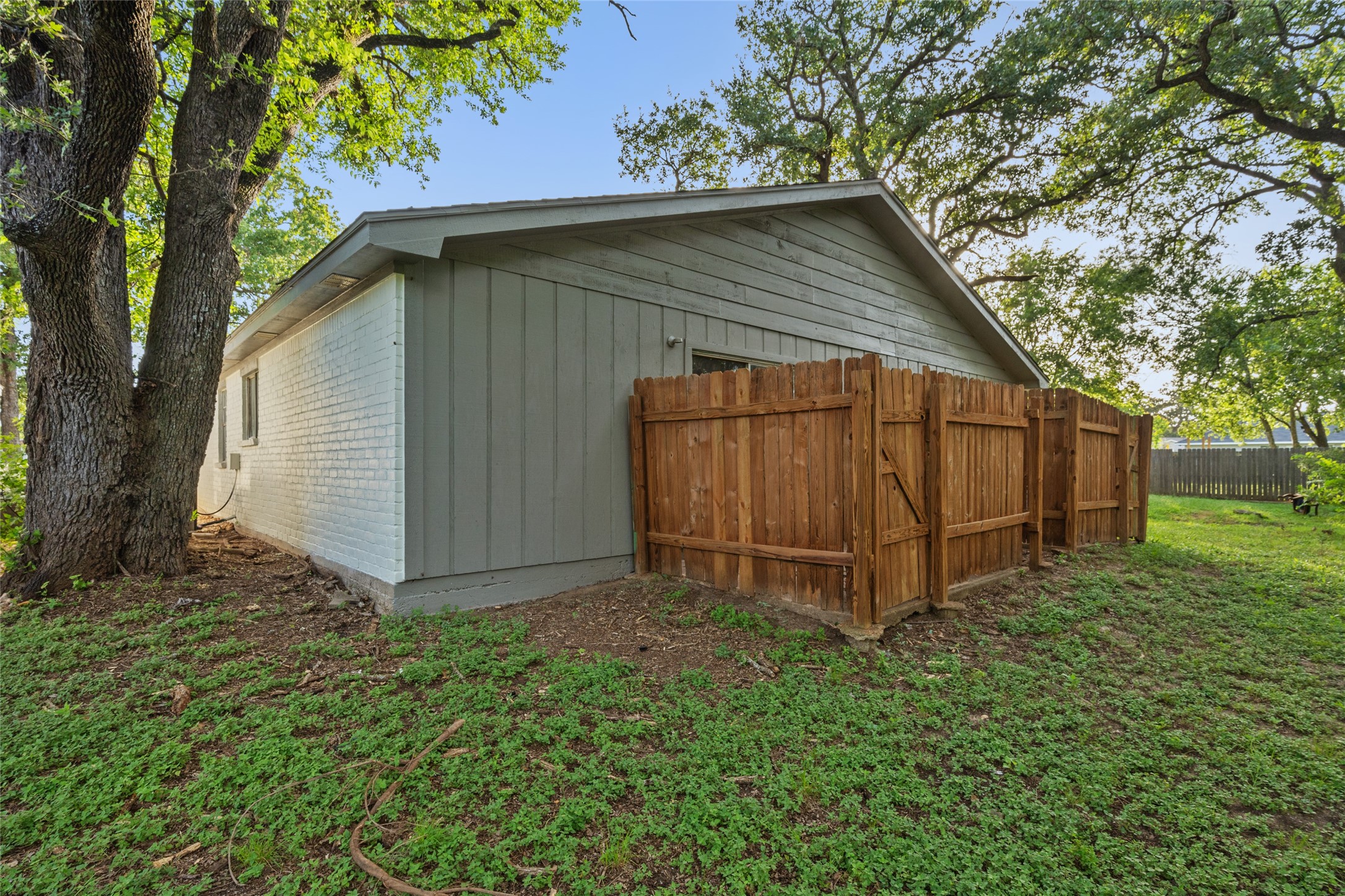 4123 Old Hearne Road Bryan, TX 77803 - Photo 11 of 11 a backyard of a house with lots of green space