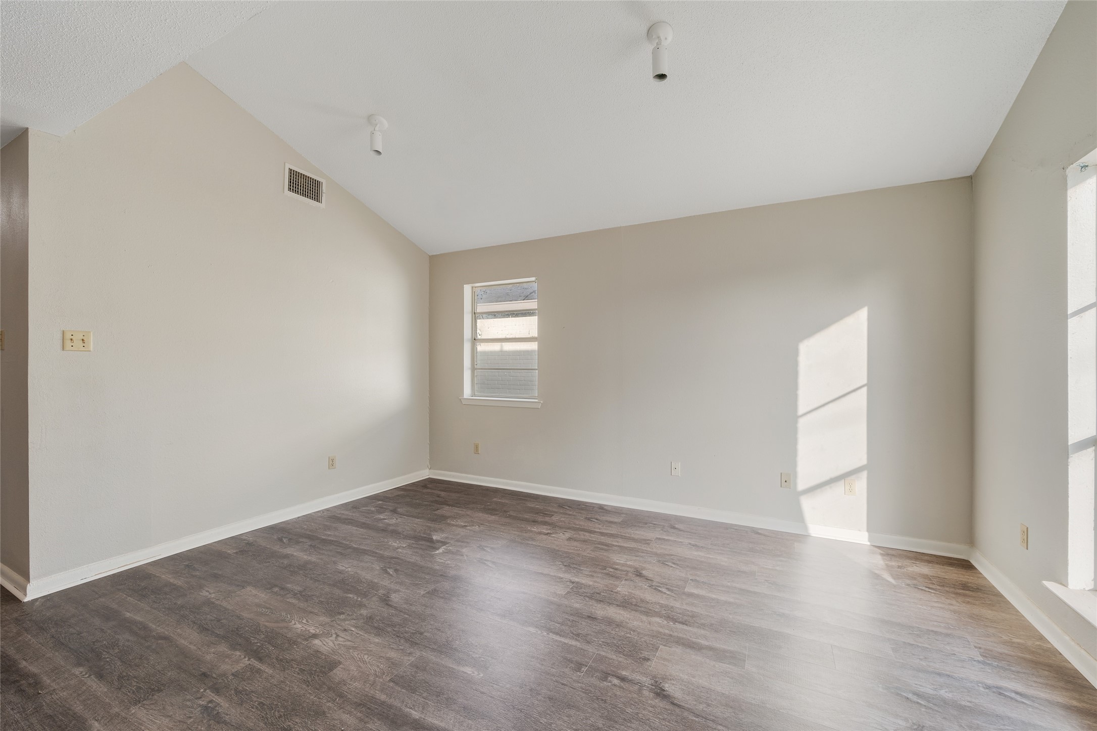 4123 Old Hearne Road Bryan, TX 77803 - Photo 5 of 11 a view of an empty room with wooden floor and windows