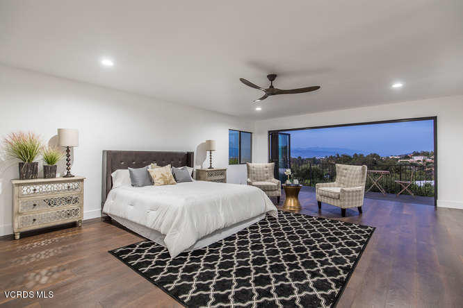 3812 Westfall Drive Encino, CA 91436 - Photo 19 of 52 a bedroom with furniture and a large window