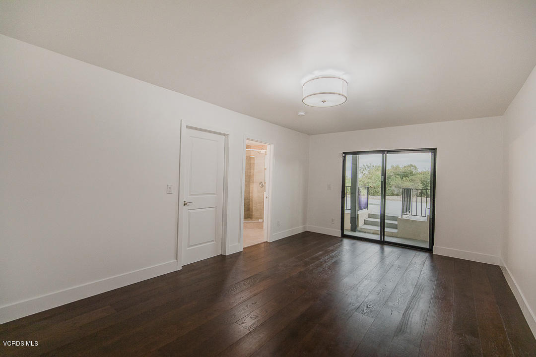 3812 Westfall Drive Encino, CA 91436 - Photo 38 of 52 a view of an empty room with wooden floor and a window
