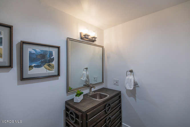 3812 Westfall Drive Encino, CA 91436 - Photo 44 of 52 a bathroom with a sink and a mirror