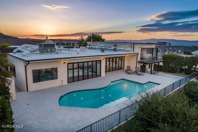 3812 Westfall Drive Encino, CA 91436 - Photo 46 of 52 an aerial view of a house with a garden and deck