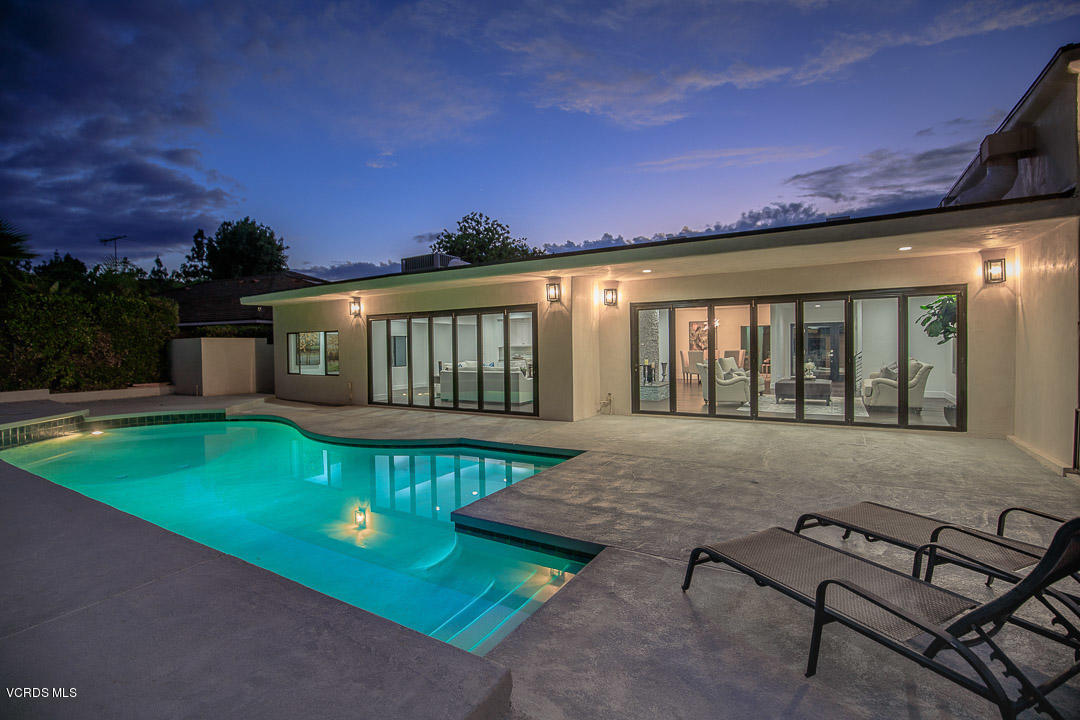 3812 Westfall Drive Encino, CA 91436 - Photo 49 of 52 a view of a house with backyard porch and sitting area
