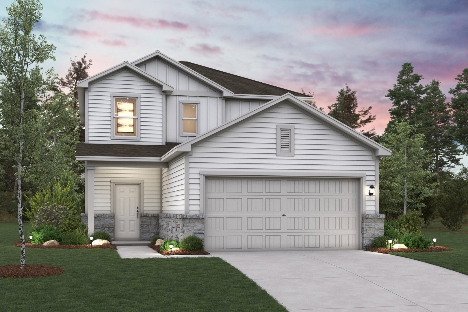 a front view of a house with a garden and garage
