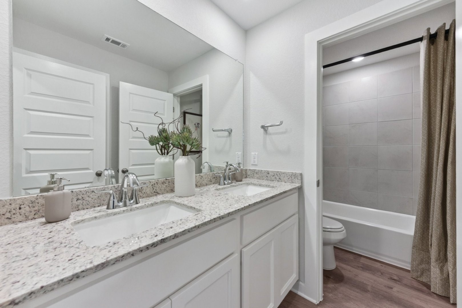 112 Hornet Street Elgin, TX 78621 - Photo 21 of 25 a bathroom with a granite countertop sink and a mirror