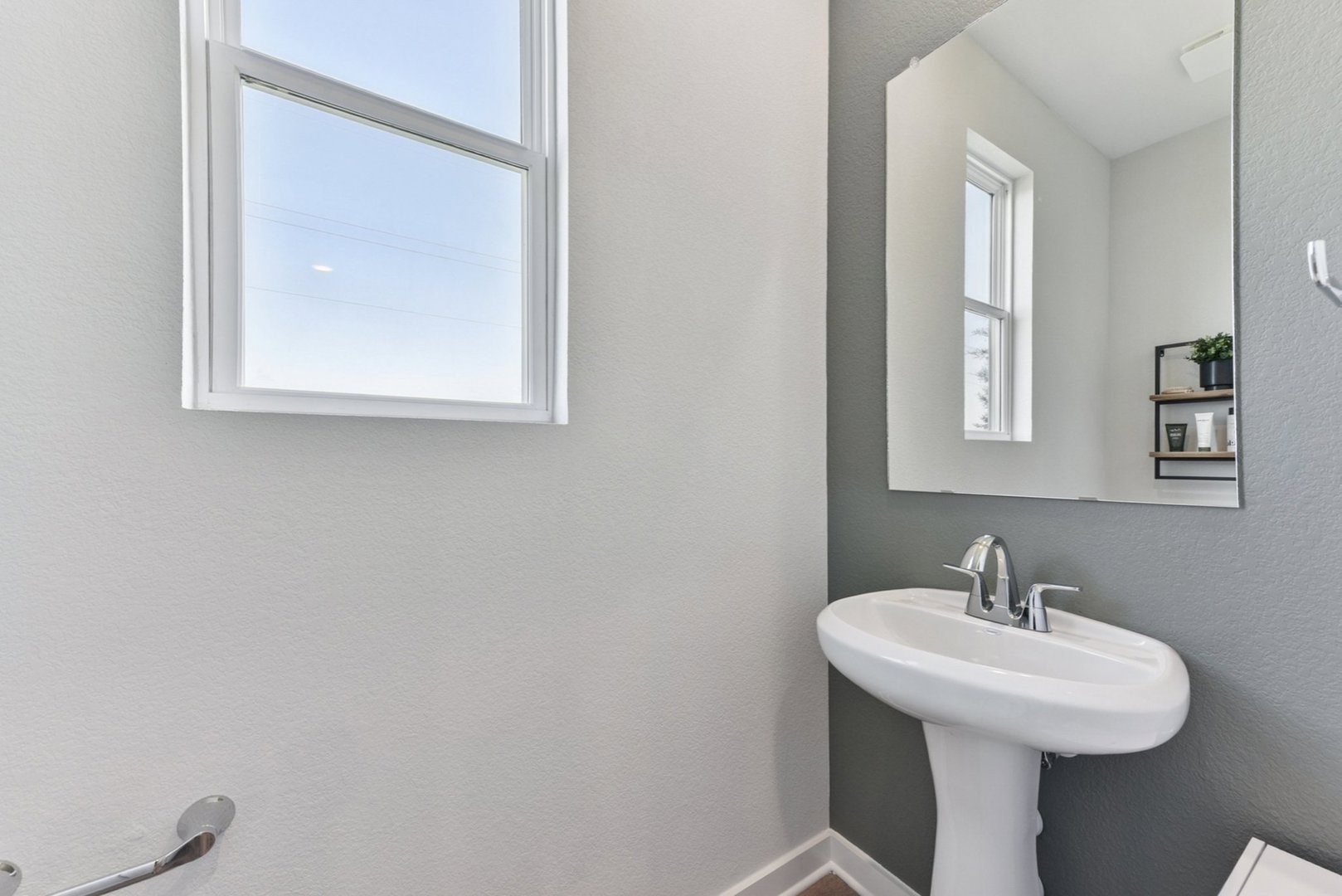 112 Hornet Street Elgin, TX 78621 - Photo 25 of 25 a bathroom with a sink a mirror and a window