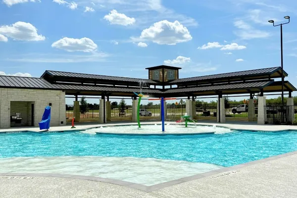 a view of a building with a swimming pool