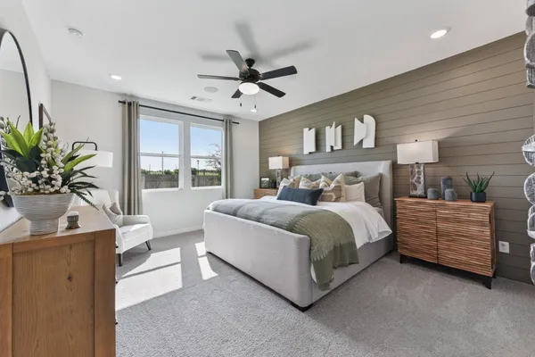 a bedroom with a large bed and a window