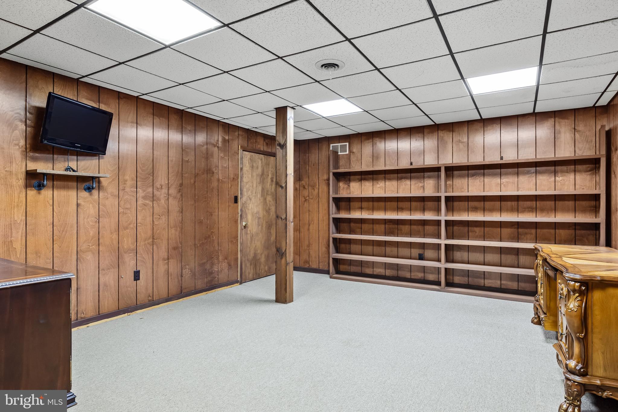 217 Hospital Road Greenwich, NJ 08323 - Photo 54 of 98 a view of an empty room with cabinet and a flat screen tv