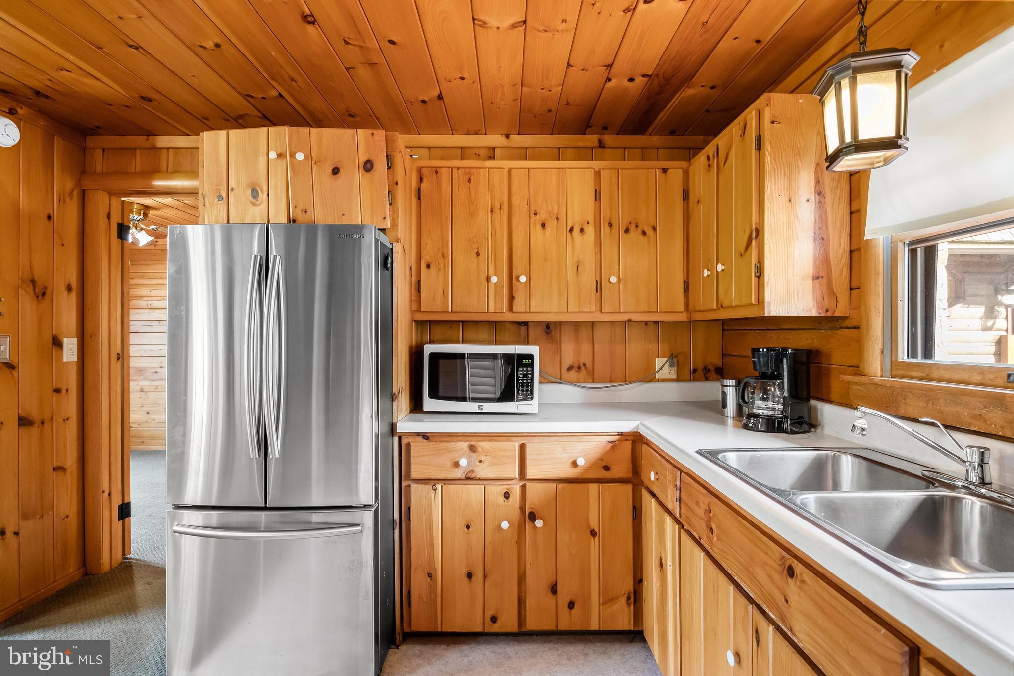 217 Hospital Road Greenwich, NJ 08323 - Photo 61 of 98 a kitchen with stainless steel appliances granite countertop a refrigerator and a sink