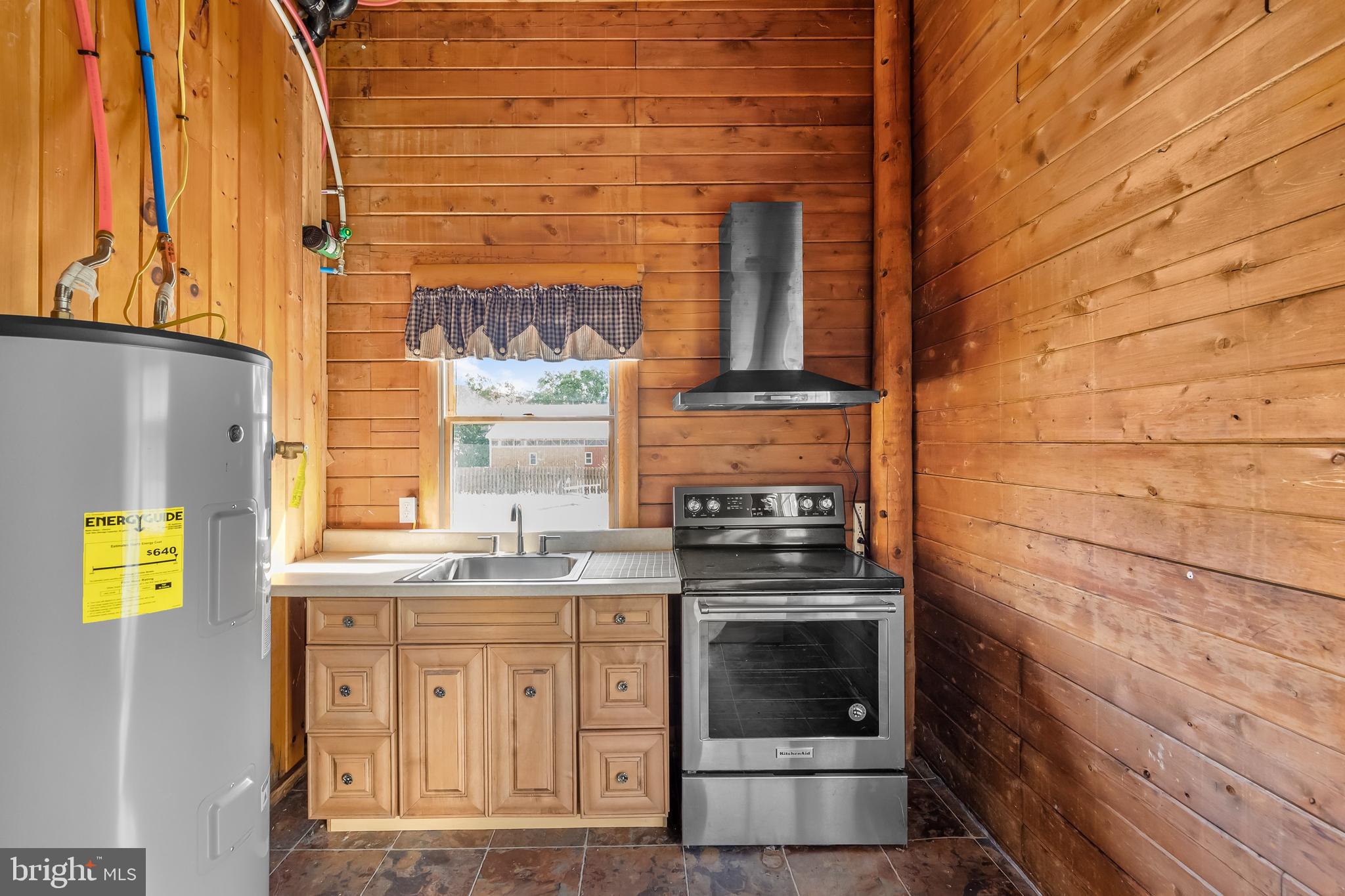 217 Hospital Road Greenwich, NJ 08323 - Photo 69 of 98 a kitchen with stainless steel appliances granite countertop a stove and a sink