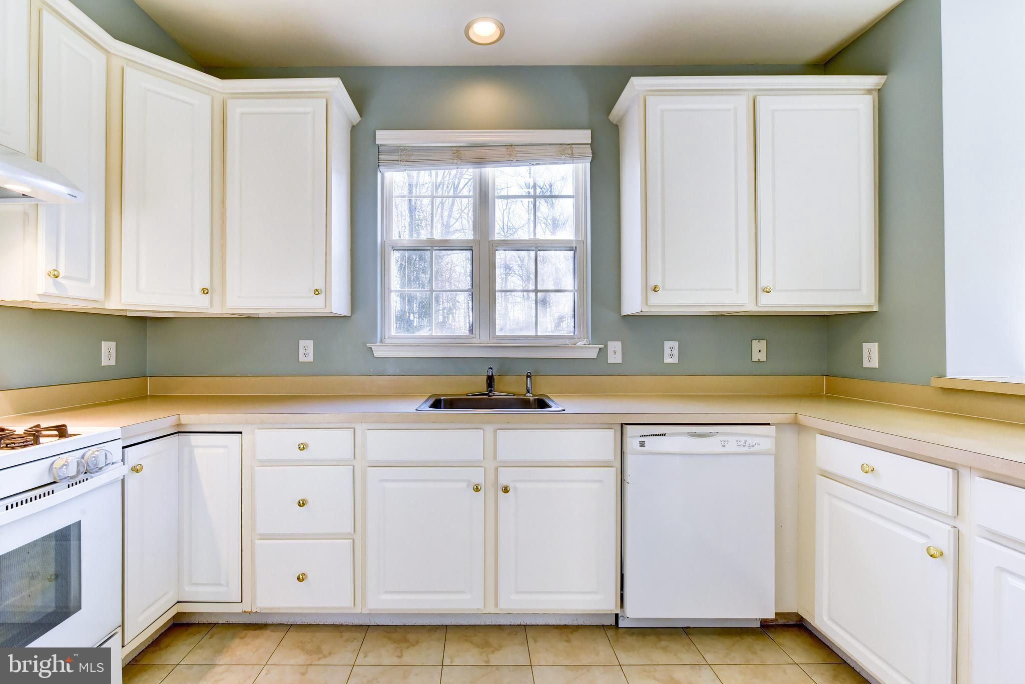 101 Warwick Road Princeton Junction, NJ 08550 - Photo 22 of 39 a view of a kitchen with white cabinets