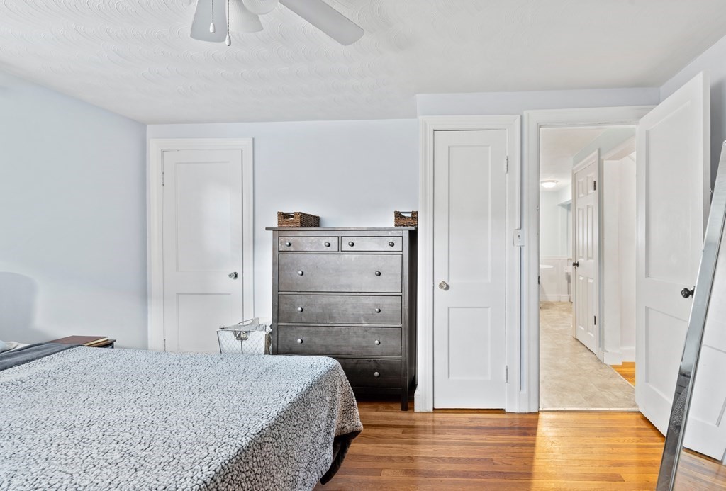 43 Fairview Street Dedham, MA 02026 - Photo 12 of 29 a bedroom with a bed and wooden floor