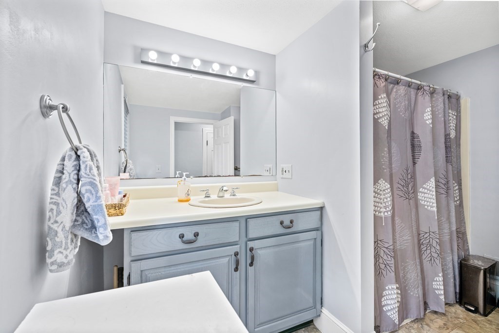 43 Fairview Street Dedham, MA 02026 - Photo 14 of 29 a bathroom with a sink double vanity and a mirror