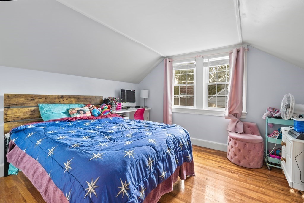 43 Fairview Street Dedham, MA 02026 - Photo 15 of 29 a bed sitting in a bedroom next to a window