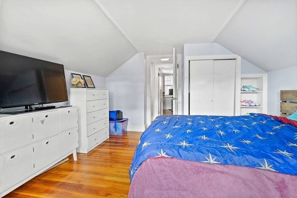 43 Fairview Street Dedham, MA 02026 - Photo 16 of 29 a bedroom with a bed and flat screen tv