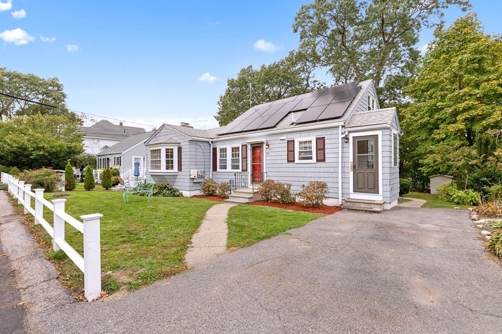43 Fairview Street Dedham, MA 02026 - Photo 2 of 29 a front view of a house with yard and green space