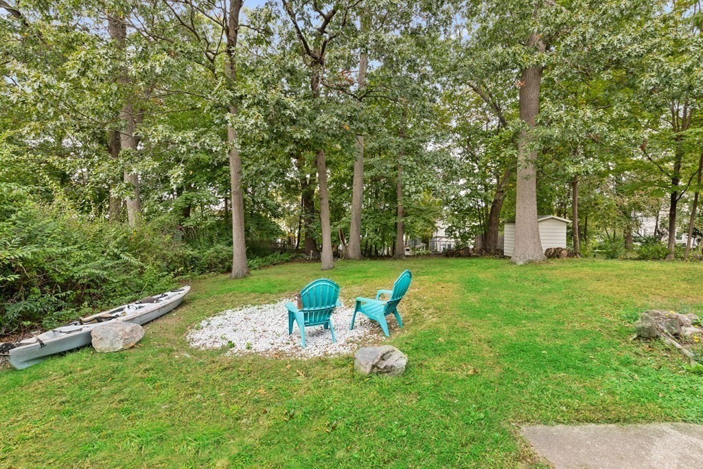 43 Fairview Street Dedham, MA 02026 - Photo 25 of 29 a backyard of a house with table and chairs