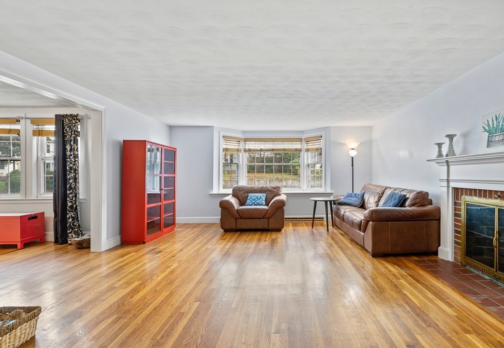 43 Fairview Street Dedham, MA 02026 - Photo 5 of 29 a living room with furniture and a fireplace