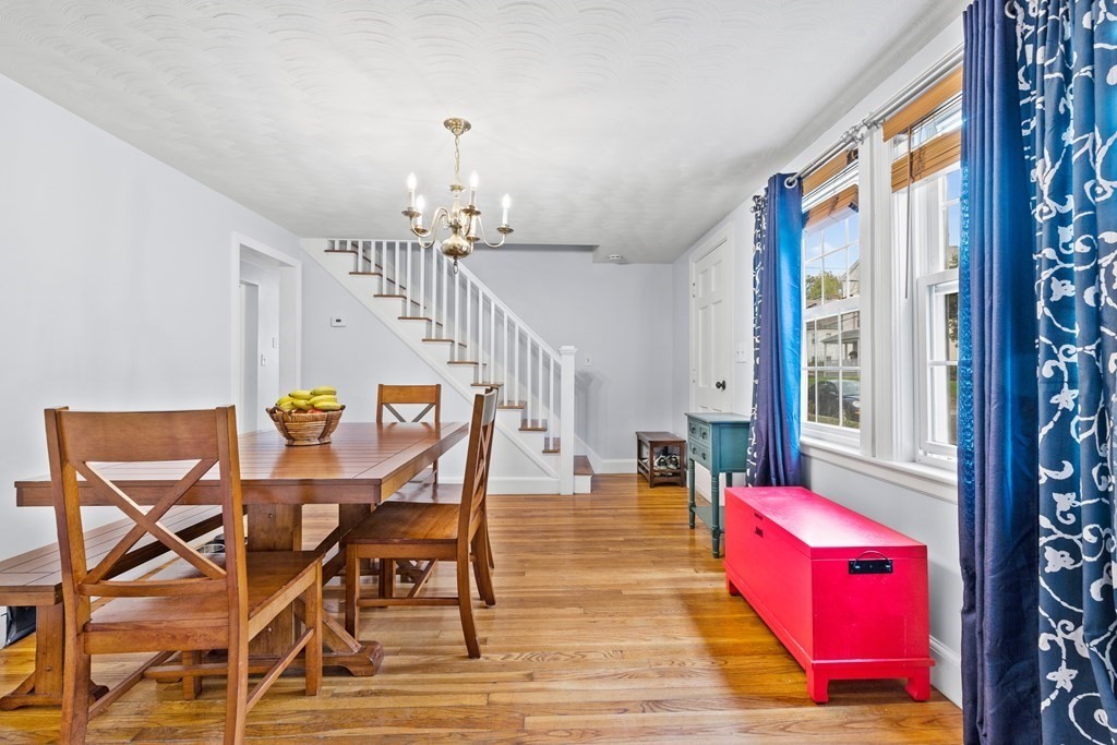 43 Fairview Street Dedham, MA 02026 - Photo 7 of 29 a view of a dining room with furniture a chandelier and wooden floor