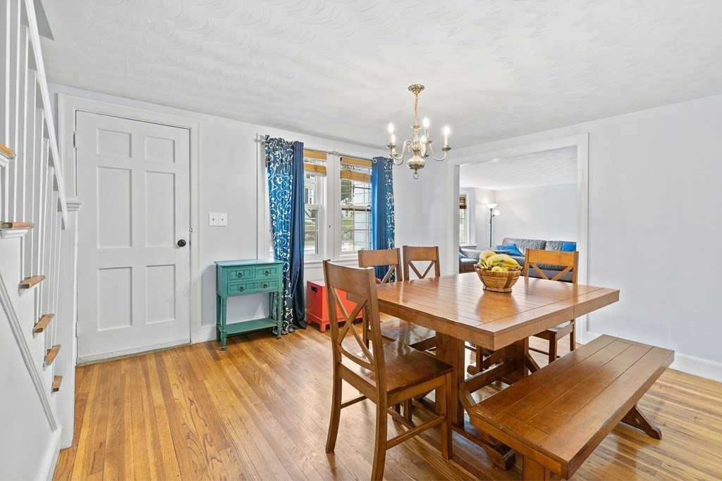 43 Fairview Street Dedham, MA 02026 - Photo 8 of 29 a dining room with furniture a chandelier and wooden floor