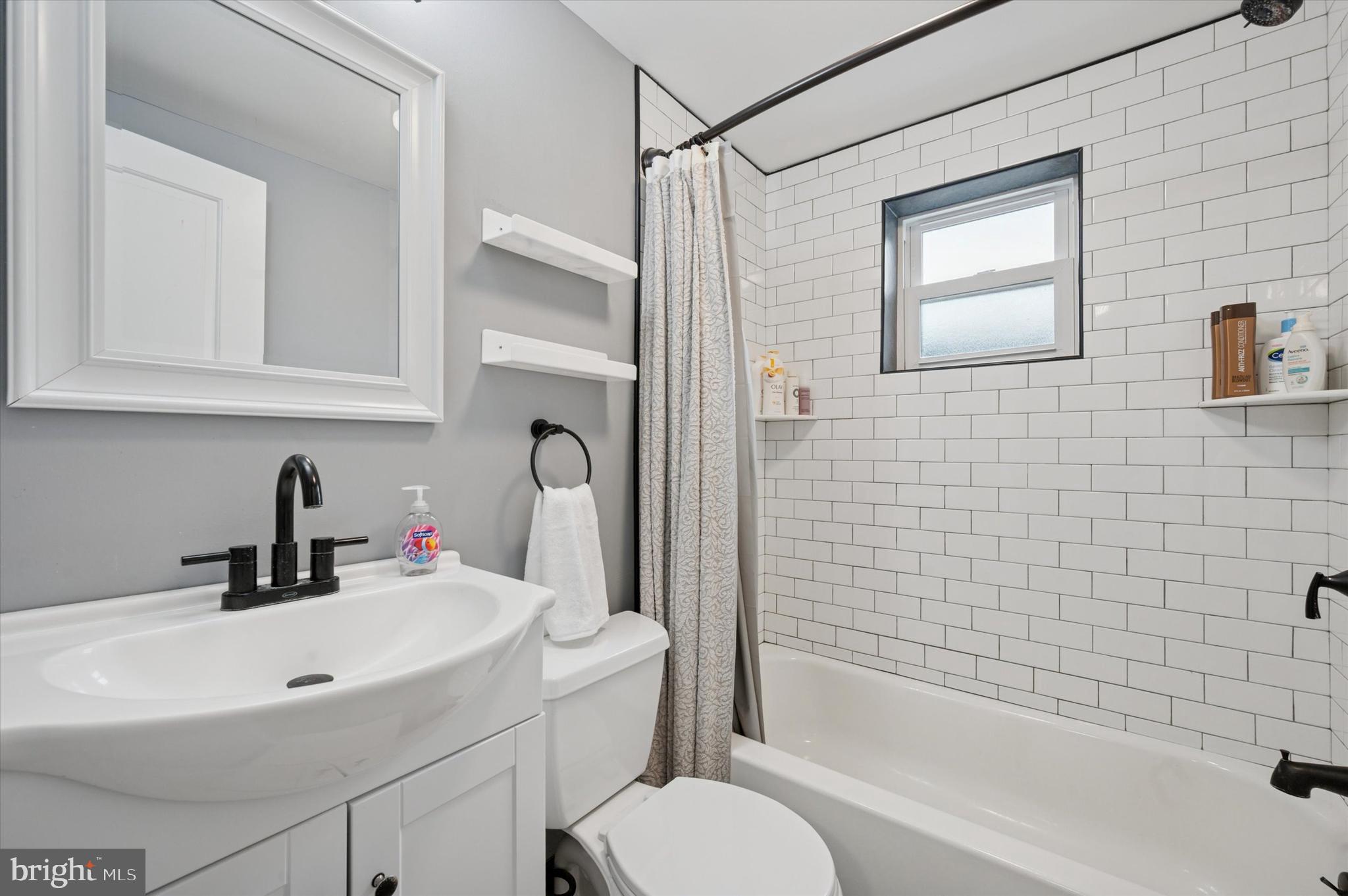 2458 Cedar Street Philadelphia, PA 19125 - Photo 12 of 15 a bathroom with a sink toilet and shower