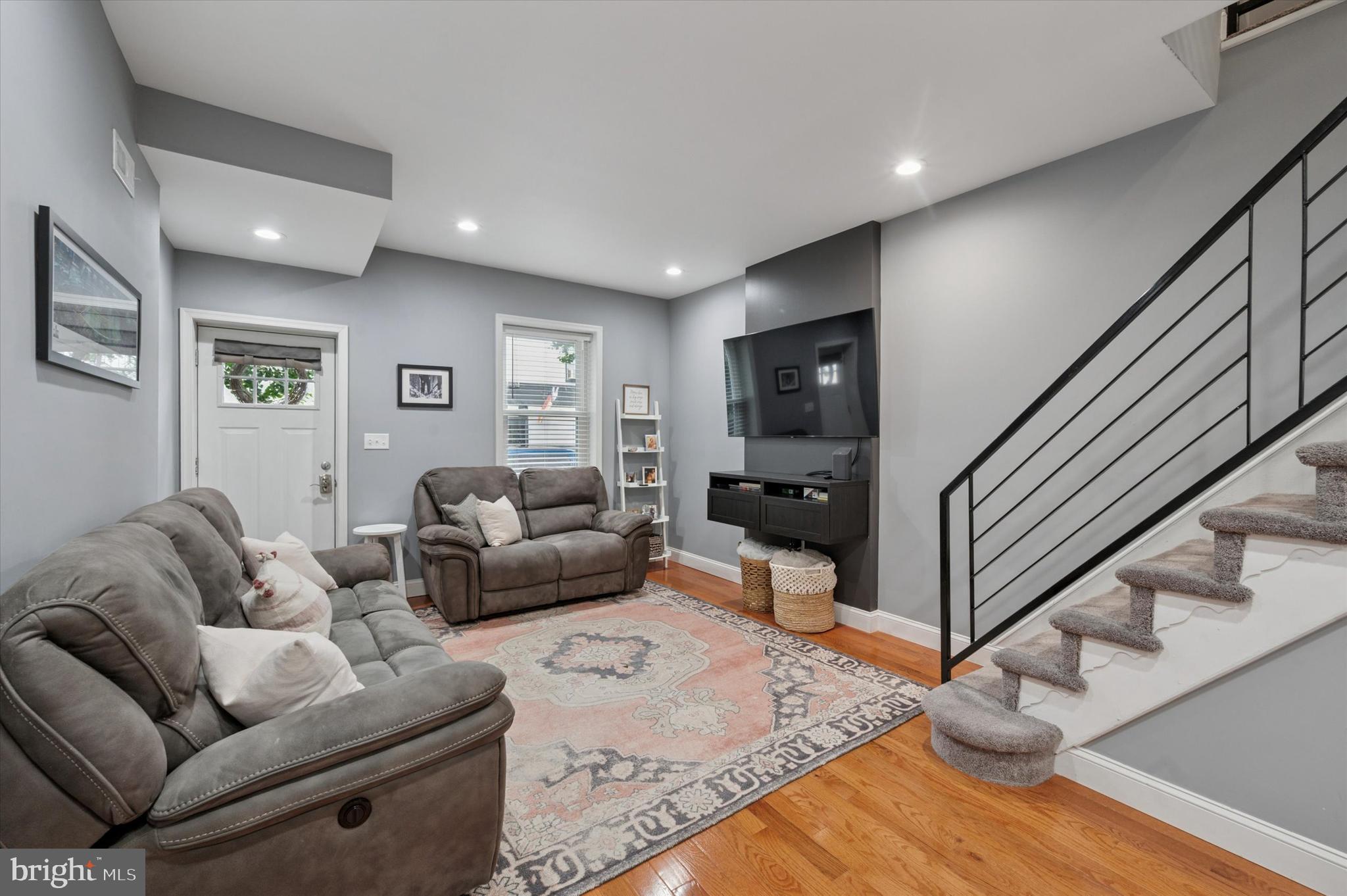 2458 Cedar Street Philadelphia, PA 19125 - Photo 5 of 15 a living room with furniture or stairs and a wooden floor