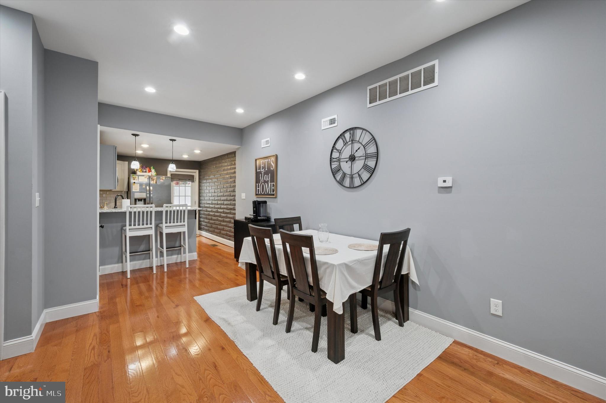 2458 Cedar Street Philadelphia, PA 19125 - Photo 6 of 15 a view of a dining room and livingroom with furniture wooden floor and a rug