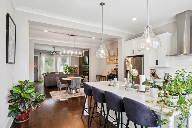 a very nice looking dining room with a table and chairs