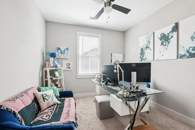 a living room with furniture and window