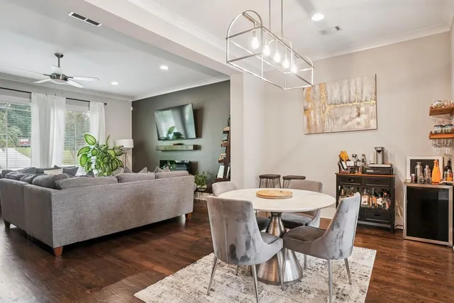 a living room with fireplace furniture and a wooden floor