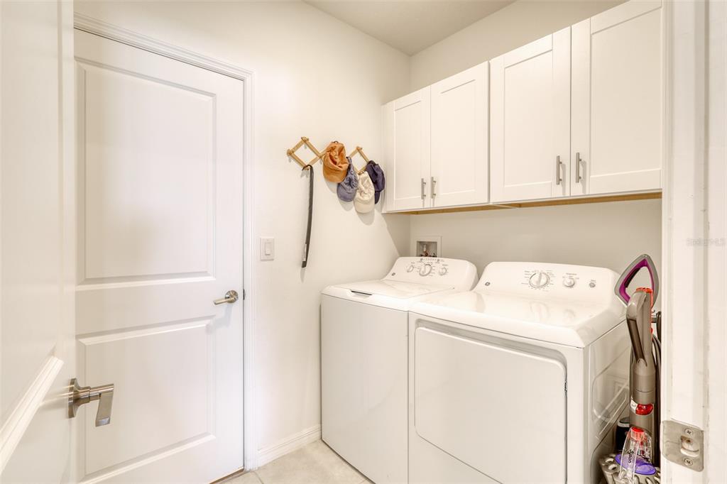111 Rain Lily Ave Spring Hill Spring Hill, FL 34609 - Photo 12 of 60 a utility room with dryer and washer