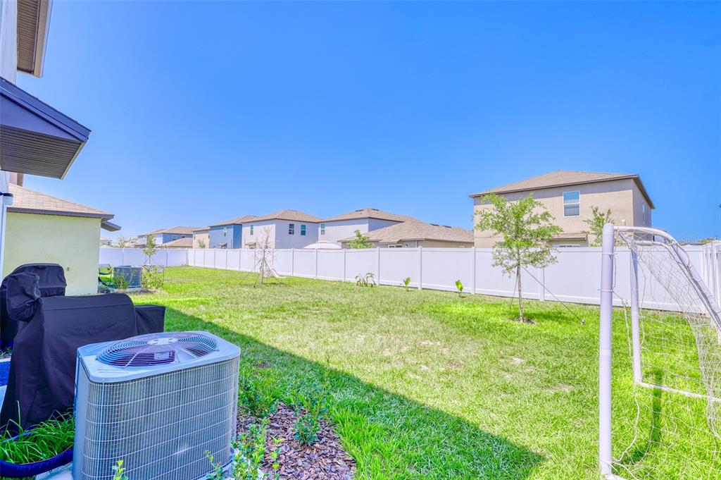 111 Rain Lily Ave Spring Hill Spring Hill, FL 34609 - Photo 23 of 60 a view of a backyard with sitting area
